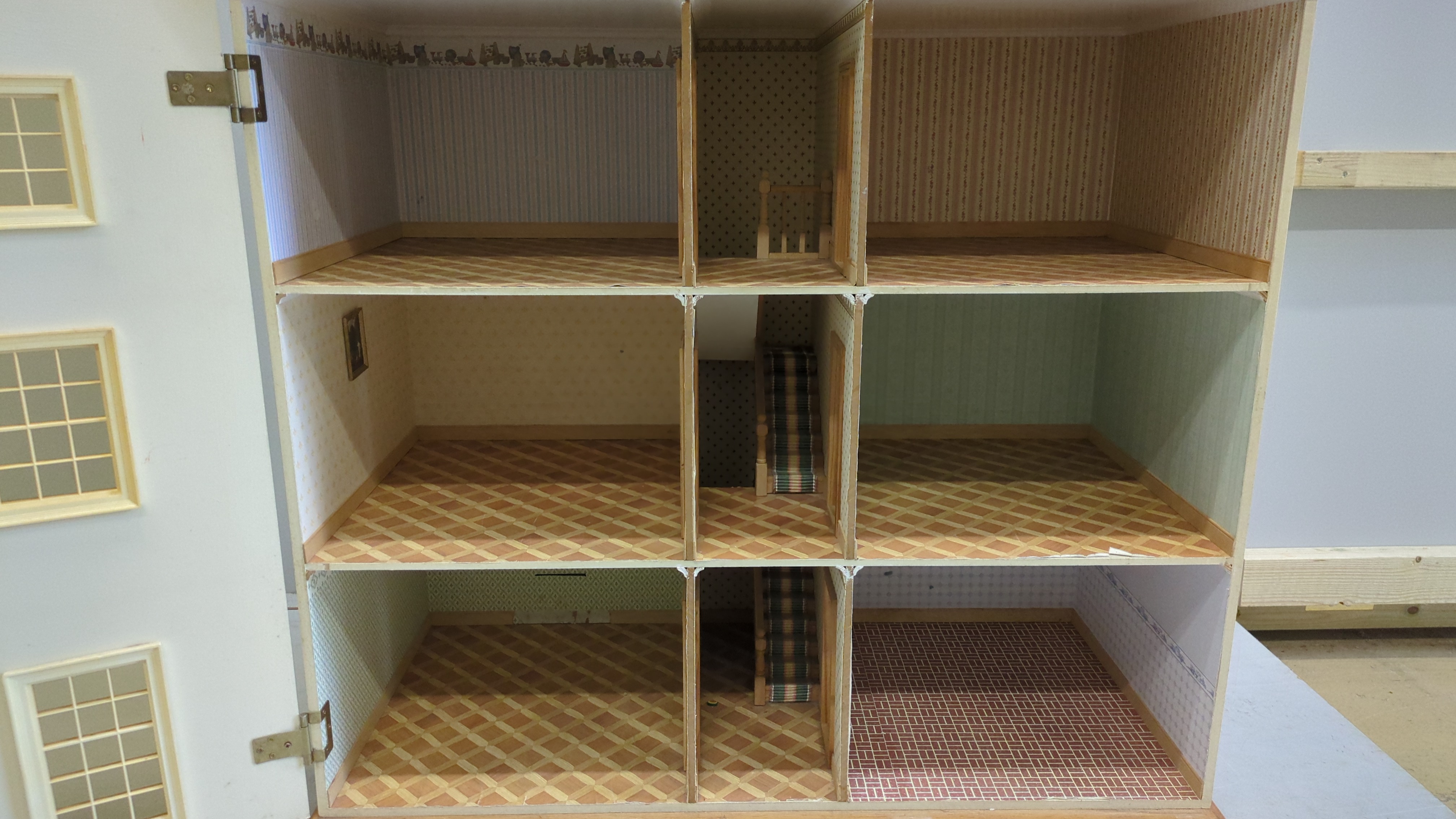 A modern Georgian style dolls house and accessories, the house is divided into six rooms on three floors, together with a collection of furniture and accessories, house dimensions; 103cm high, 90cm wide and 44cm deep